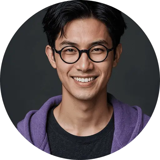 Young man wearing glasses and hoodie.
